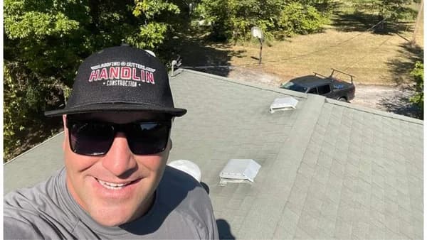 Chris Handlin working on a roof